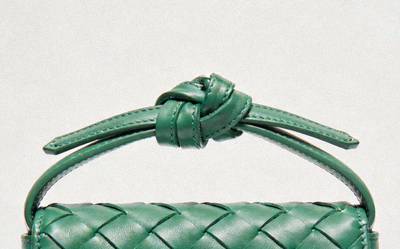 Bottega Veneta Mini Jodie bag in parakeet green intrecciato leather with a signature knot closure at the top