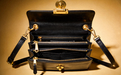 Classic Black Leather Shoulder Bag with gold-tone hardware and multiple compartments