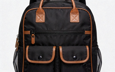 Designer-inspired replica backpack in black nylon with leather accents and multiple compartments