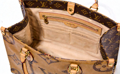 Louis Vuitton Onthego MM tote bag in giant monogram empreinte leather, open view showing interior compartments
