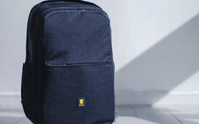 Luxury leather backpack in cognac brown with gold zippers and padded straps