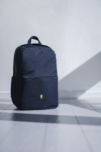 Practical and stylish black leather backpack with multiple zippered compartments for urban commuting