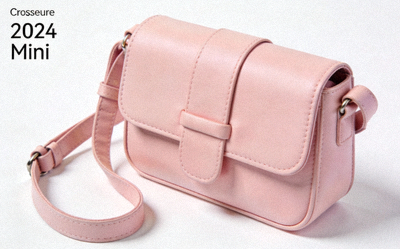 2024 Mini Crossbody Bag in pastel pink with adjustable strap and front flap closure