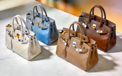 Luxury leather tote bag collection in neutral tones featuring structured shapes and premium hardware